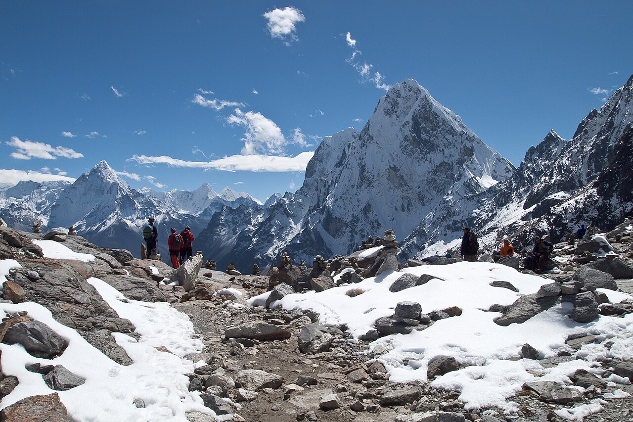 Trekkers crossing the glaciated Cho La Pass at high altitude